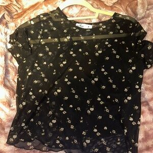 Hollister top , see through with floral pattern and sewn in black tank sz Medium